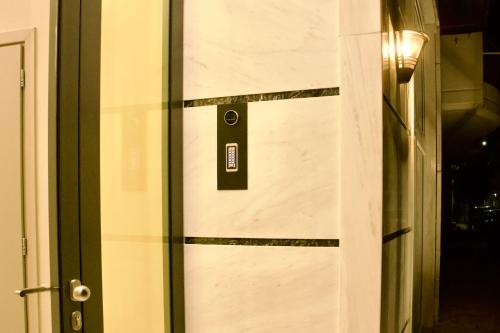 a door with a sign on the side of it at Piraeus Relax in Piraeus