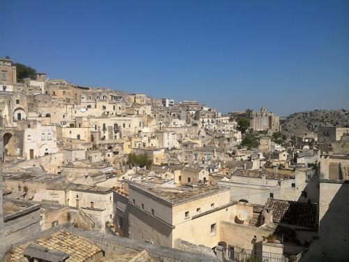 a group of buildings on top of a mountain at Alla dimora di Chiara Suite and Rooms in Matera