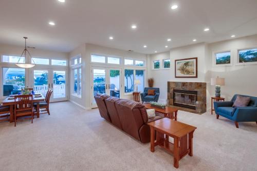 a living room with a couch and a fireplace at Point Loma Serenity in San Diego