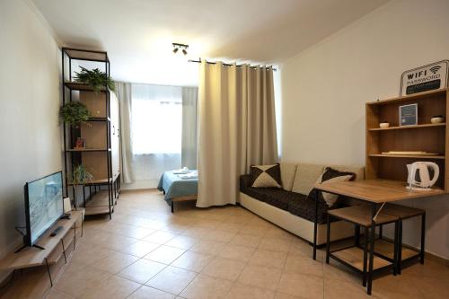 a living room with a couch and a table at ILIRIA Apartment in Durrës