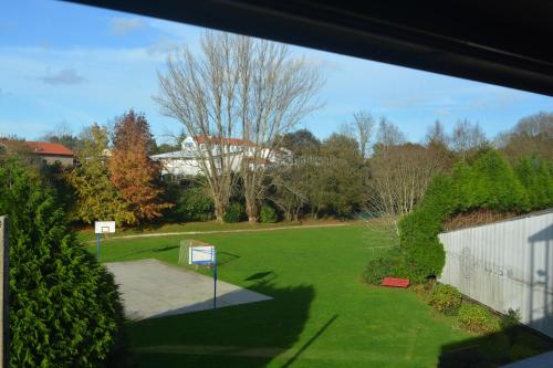 a view from a window of a yard at Ruta Jacobea in Lavacolla