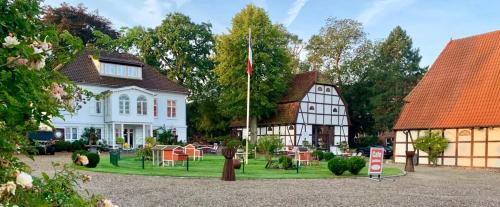 a house with a flag in front of it at Remise 2 in Neustadt in Holstein