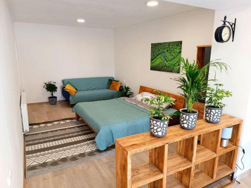 a living room with a bed and a couch at Gasthaus Tauchen with kitchen in Mönichkirchen