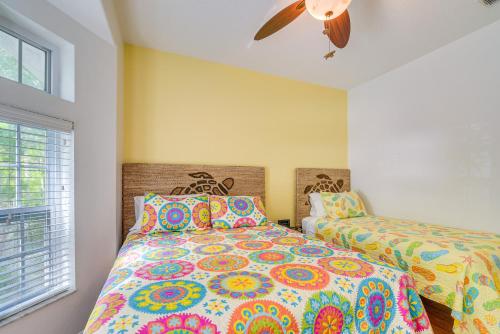 a bedroom with two beds and a ceiling fan at Decks, Docks and Kayaks Waterfront Homosassa Gem in Homosassa