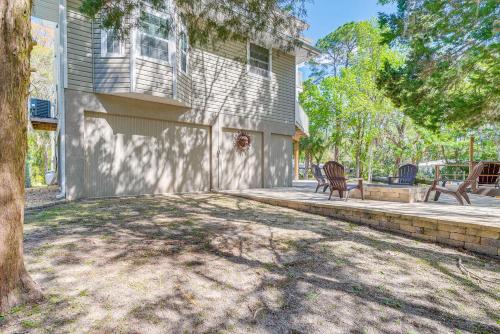 a house with a tree in front of it at Decks, Docks and Kayaks Waterfront Homosassa Gem in Homosassa