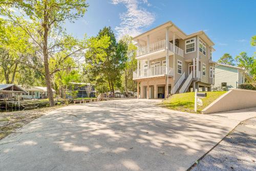 a large house with a driveway in front of it at Decks, Docks and Kayaks Waterfront Homosassa Gem in Homosassa