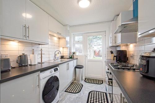a kitchen with a sink and a dishwasher at EDSPACE in Abbey Wood
