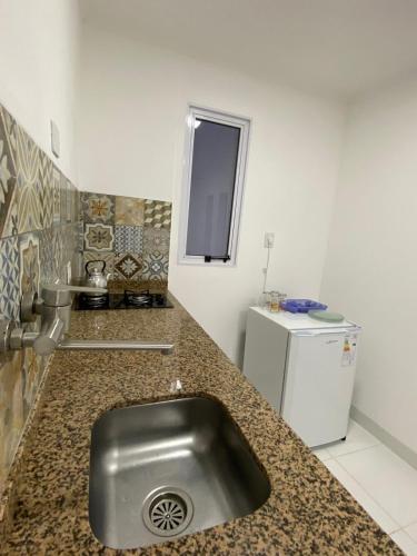 a kitchen with a stainless steel sink in a counter at Sarmiento 595 in Paso de los Libres