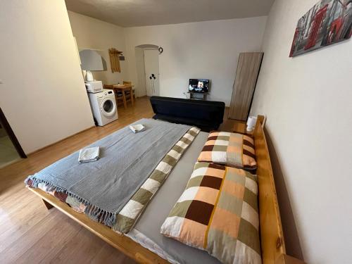 a bedroom with a bed in a room with at Apartman Centrum in Banská Bystrica