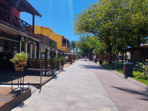 an empty street in a town with buildings at Pousada Sonho da Lagoa in Praia do Forte