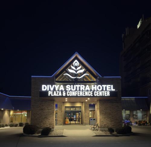 a hotel sign on the front of a building at Divya Sutra Plaza and Conference Centre, Vernon, BC in Vernon