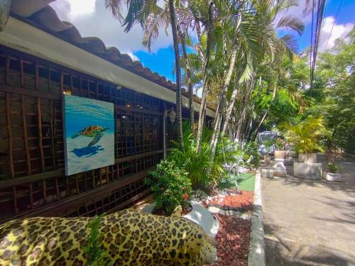 a building with a painting on the side of it at Pousada Sonho da Lagoa in Praia do Forte