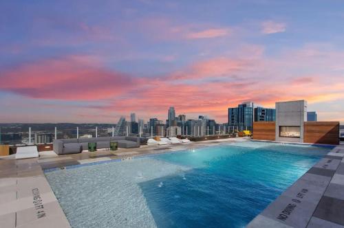 a large swimming pool on the roof of a building at Luxury 2BR Rooftop Pool Austin by Barclé in Austin