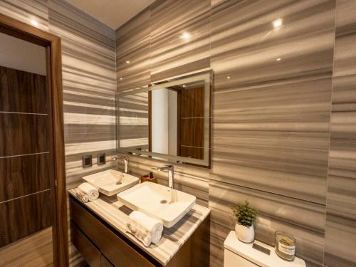 a bathroom with a sink and a mirror at Nuevo Dpt l Alberca + Padel l Soumaya 10 min in Mexico City