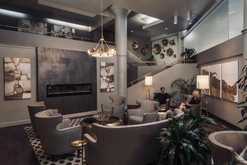 a lobby with chairs and a waiting room at Haywood Park Hotel, an Ascend Collection Hotel in Asheville