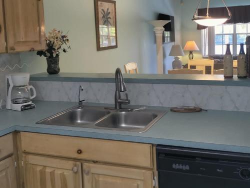 a kitchen with a sink and a counter top at Beach Paradise with Pool and Boating Dock in Freeport