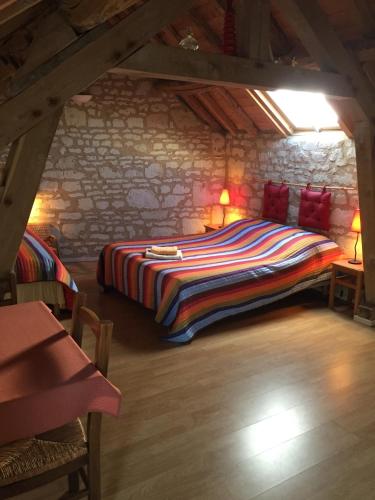 Postel nebo postele na pokoji v ubytování Les Caves