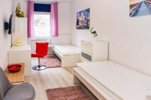 Postel nebo postele na pokoji v ubytování Apartement für 6 Personen in Magdeburg, L