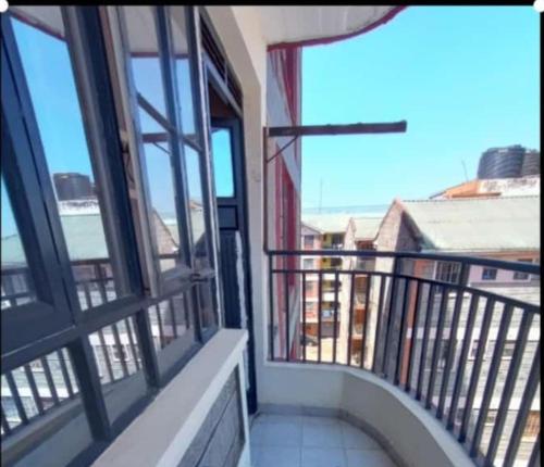 a balcony with windows and a view of a building at Studios in roysambu in Nairobi