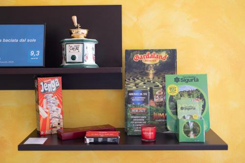a shelf with a bunch of products on it at Terrazza baciata dal sole in Lazise