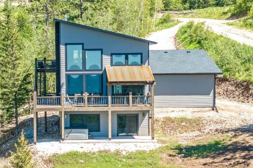a house with a wrap around porch and a deck at Golden Eagle`s in Lead