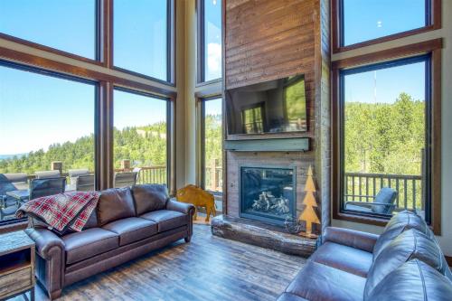 a living room with a couch and a fireplace at Golden Eagle`s in Lead