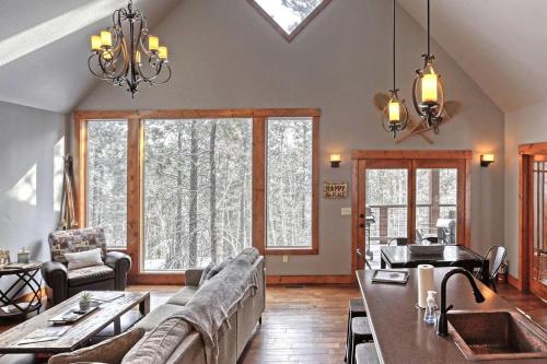 a living room with a couch and a table at Gold Rush Lodge in Lead