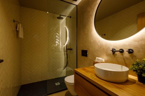 a bathroom with a sink and a mirror at Dajas Douro Valley - Exclusive Villas in Sande