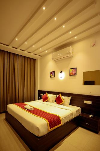 a bedroom with a large bed in a room at Konfudha Resort in Kalpetta