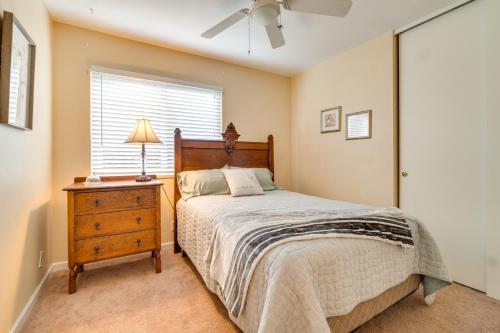 a bedroom with a bed and a dresser and a window at Sun-Kissed Orangevale Home with Private Hot Tub! in Orangevale
