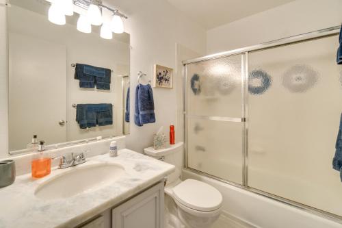 a bathroom with a toilet and a sink and a shower at Sun-Kissed Orangevale Home with Private Hot Tub! in Orangevale