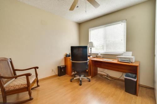an office with a desk with a computer and a chair at Sun-Kissed Orangevale Home with Private Hot Tub! in Orangevale
