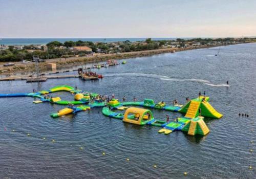 a water park with a bunch of water slides at Logement T2 au coeur du village in Gruissan