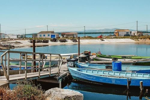 two boats docked at a dock in the water at Logement T2 au coeur du village in Gruissan