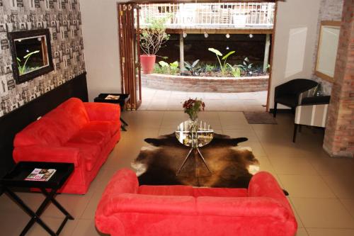Χώρος καθιστικού στο Zebrina Guest House