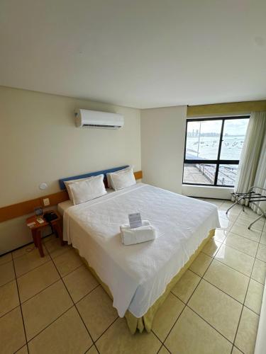 Кровать или кровати в номере Iate Plaza Hotel