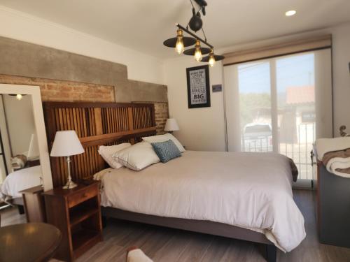 Ένα ή περισσότερα κρεβάτια σε δωμάτιο στο Loft low cost Cachagua