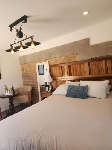 Ένα ή περισσότερα κρεβάτια σε δωμάτιο στο Loft low cost Cachagua