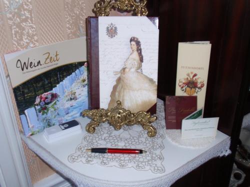 a table with a picture of a woman in a wedding dress at Villa-Angelina in Langenzersdorf