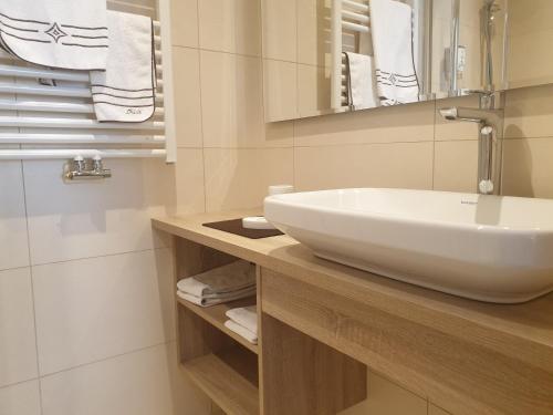 Koupelna v ubytování Garni Le Chalet