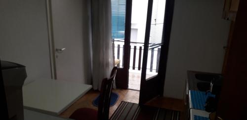 a room with a view of a balcony with a window at Apartman Struga in Struga