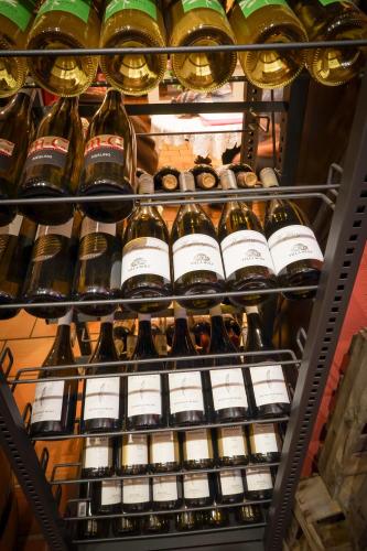 a refrigerator filled with lots of bottles of wine at Landgasthaus Gieseke-Asshorn in Bohmte
