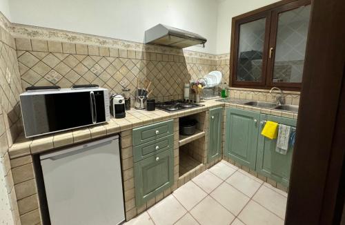Kuchyň nebo kuchyňský kout v ubytování Villa Lidia