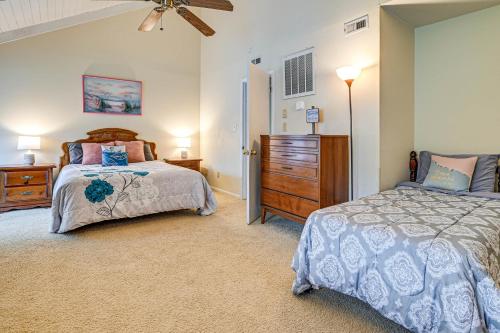 a bedroom with two beds and a ceiling fan at Bohemian Beach Retreat - 2 Blocks to Ocean! in Myrtle Beach