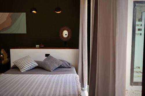 Postel nebo postele na pokoji v ubytování Highlight Studio Apartment in Playa Negra