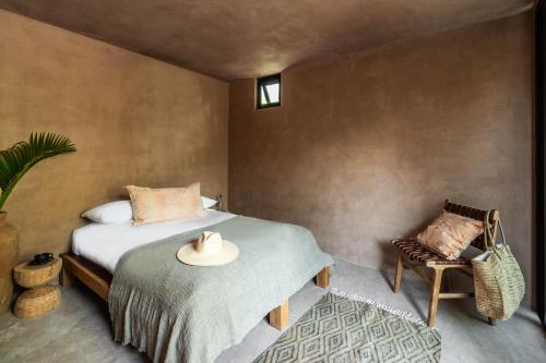 Una cama o camas en una habitación de Xela Tulum - Member of Design Hotels