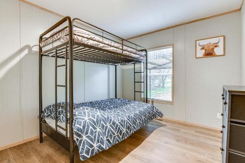 a bedroom with a bunk bed in a room at Country Creekside Haven with Private Hot Tub and Deck! in Weatherford