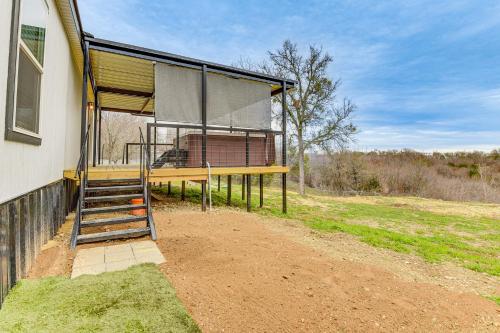a building with a porch with a staircase next to it at Hudson Oaks Country Creekside Home Hot Tub and Deck in Weatherford