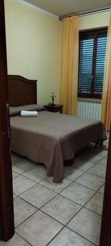 Postel nebo postele na pokoji v ubytování Hotel Colosseo Colleferro
