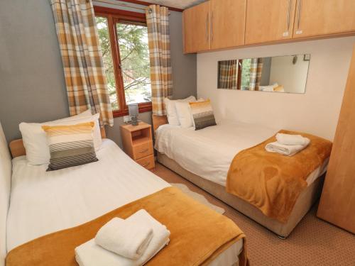 Postel nebo postele na pokoji v ubytování Evergreen Lodge